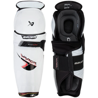 Pair of Bauer hockey shin guards on a white background